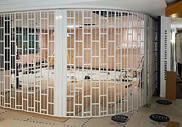 Curved opening secured by a FlexiGlide Vision Guard sliding security shutter