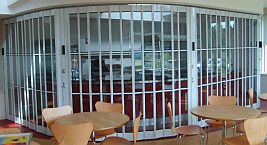 FlexiGlide sliding shutter installed in front of a food servery counter.