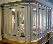 FlexiGlide sliding shutter installed on a counter. The disability area has a custom-made panel that folds down when the counter is in use.