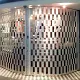 Coffee bar in a terminal building closed off by a curved sliding security shutter of the FlexiGlide Barrier type