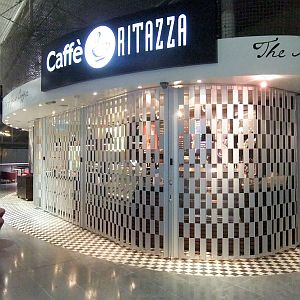 Sliding shutter in front of a cafetaria servery