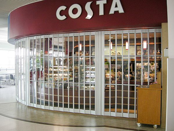 Sliding shutter closing off a Costa cafetaria at a ferry terminal