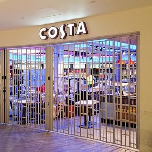 FlexiGlide sliding shutter at a storefront entrance in a shopping centre